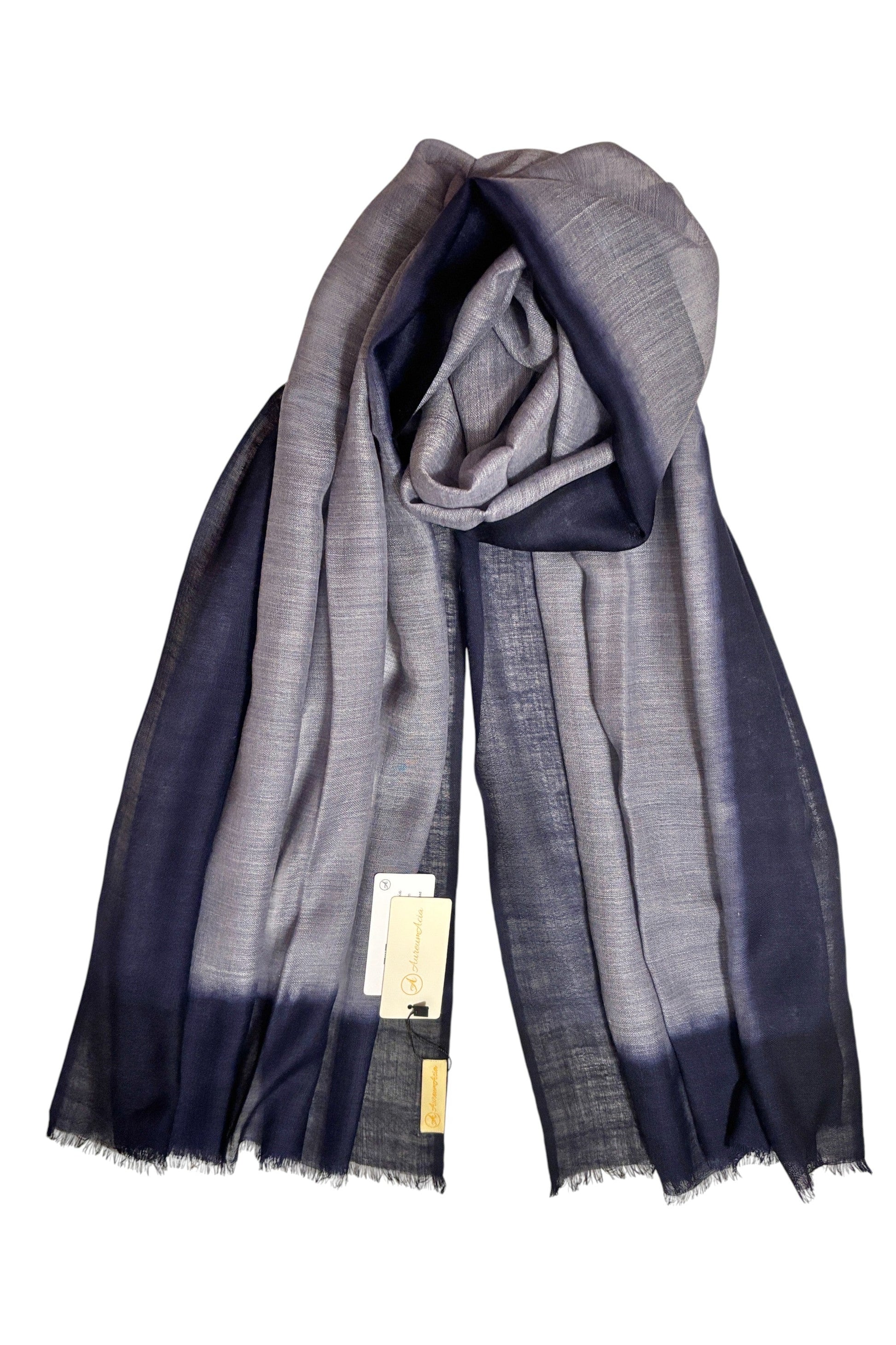 Folded fabric with gradient color pattern on a white background