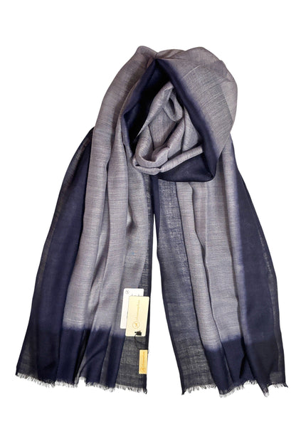 Folded fabric with gradient color pattern on a white background