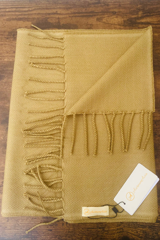 Dry henna coloured woollen stole in herringbone pattern with fringes at the end 