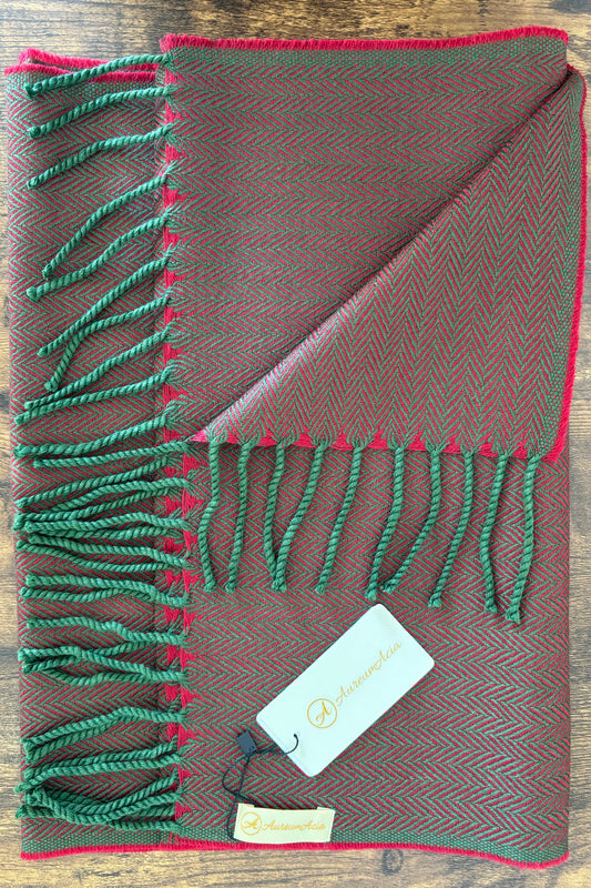 Red and bottle green woollen stole in herringbone pattern with fringes at the end 
