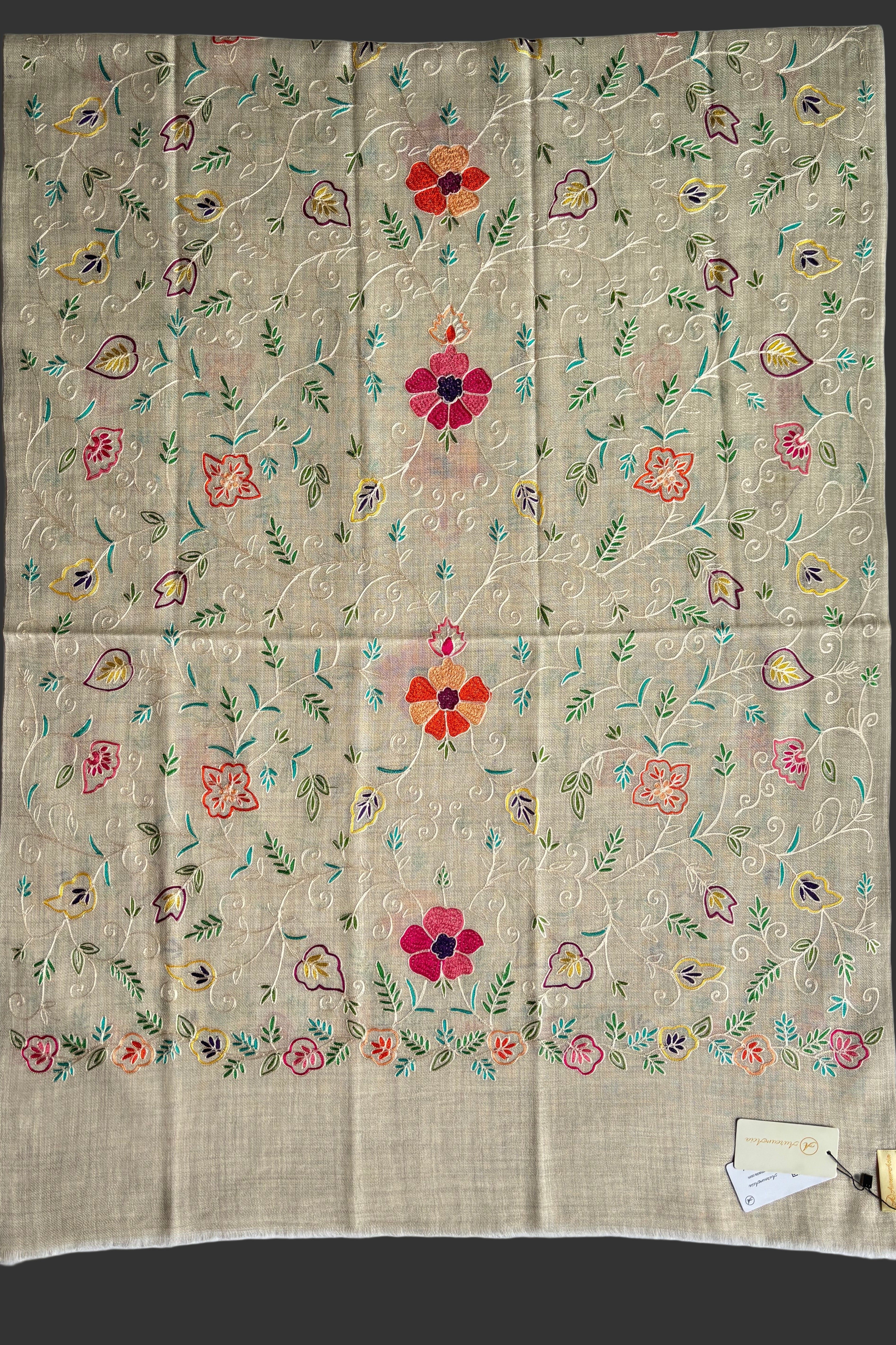 Floral embroidered scarf on a beige base