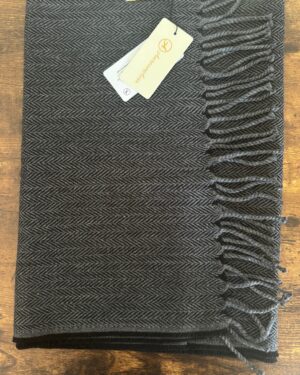 Charcoal and black woollen scarf in herringbone pattern with fringes at the end 